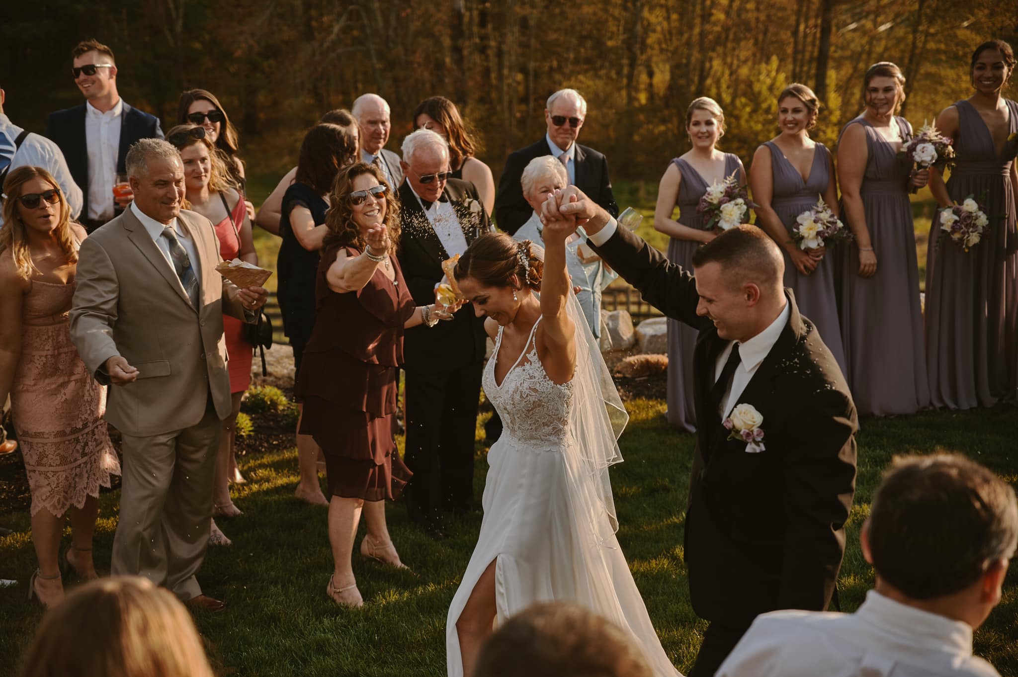Documentary style capture of wedding guests celebrating at a Massachusetts reception